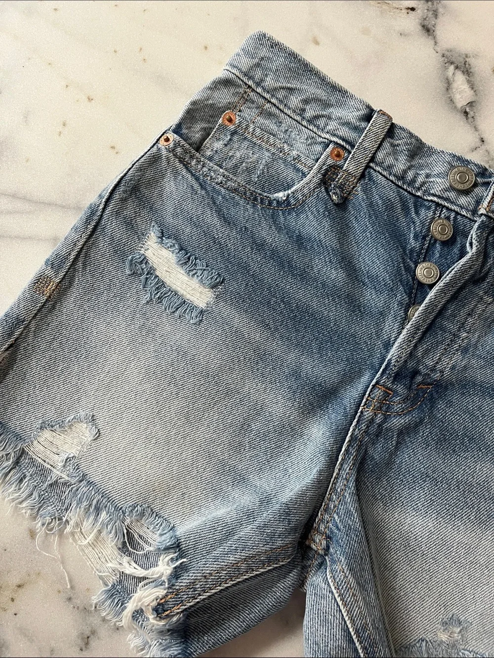 Free People distressed denim shorts